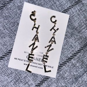 CHANEL earrings dangle with stones